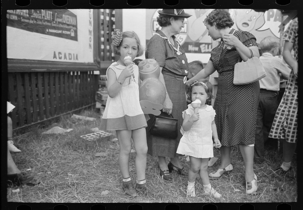 Kids licking ice cream to stay cool. 