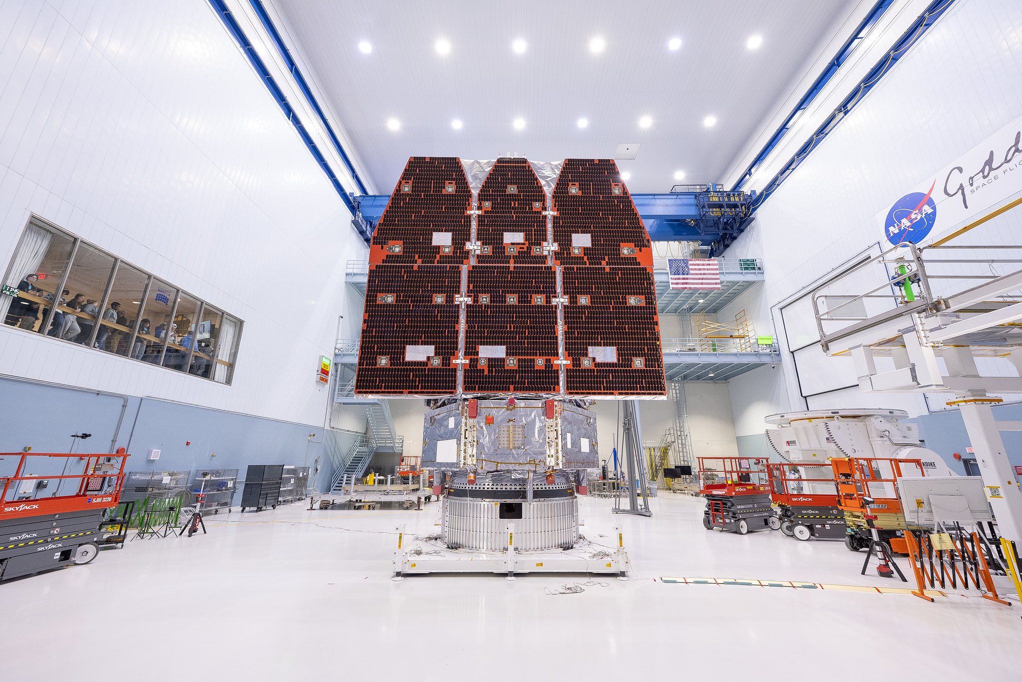a space telescope with three panels in a lab