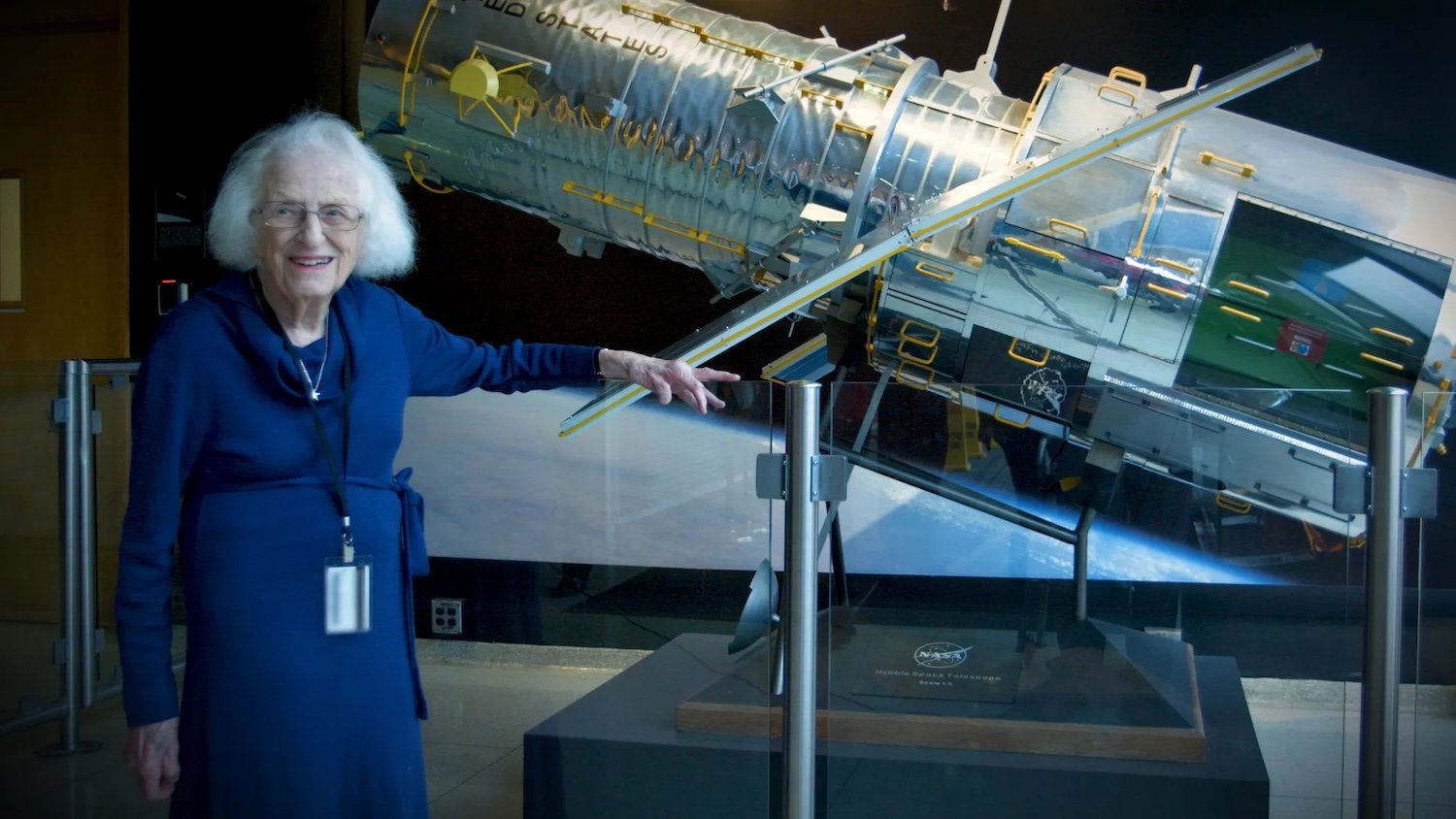 Nancy Grace Roman stands next to a scale model of the Hubble Space Telescope outside the Hubble control center at NASA’s Goddard Space Flight Center in Greenbelt, Maryland. Roman is known as the “Mother of Hubble.” Image: NASA