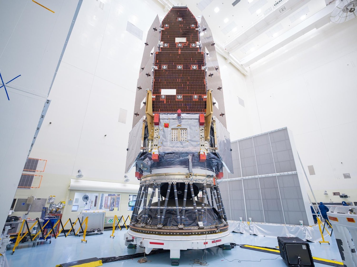 NASA's Nancy Grace Roman Space Telescope pictured on Friday, August 7, 2026, after engineers and technicians working inside the Payload Hazardous Servicing Facility at NASA’s Kennedy Space Center in Florida had carefully mated the observatory to its payload adapter and a strut payload attach fitting, a specialized piece of hardware designed for large, heavy loads. This allows the team to secure the payload to the second stage on SpaceX’s Falcon Heavy rocket. Image: Kennedy Space Center / NASA.