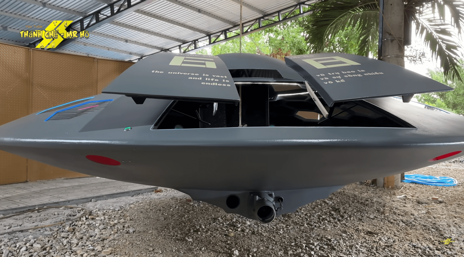 a flying saucer with a retractable door