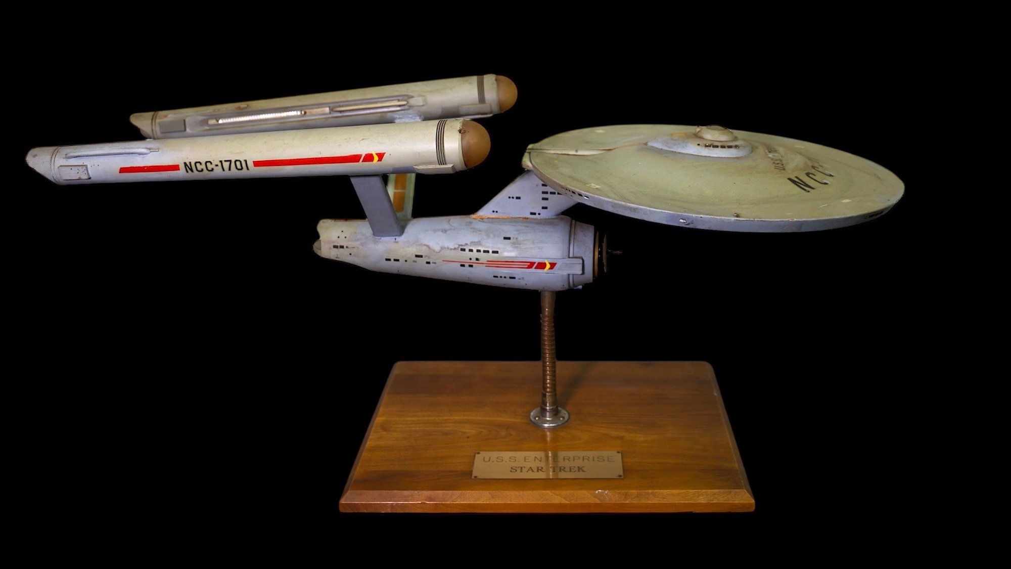 Original 11-inch Star Trek USS Enterprise model on wooden stand