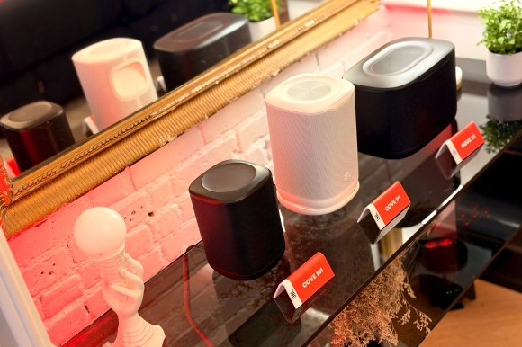 JBL Cove Wi-Fi speakers sitting on a credenza