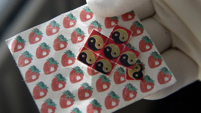 Drugs and drug-taking equipment - a sheet of LSD tabs. (Photo by Paul Faith - PA Images/PA Images via Getty Images)