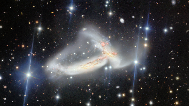Image of NGC 7253, which features two spiral galaxies colliding into one another