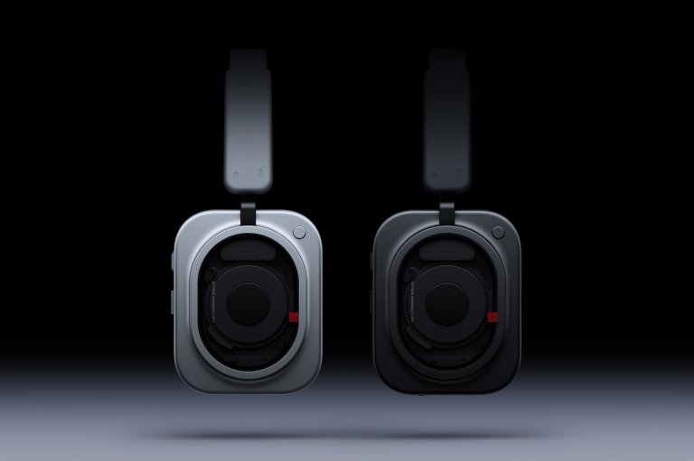 The earcup of the Nothing (1) Headphone shown in both the white and black colorway