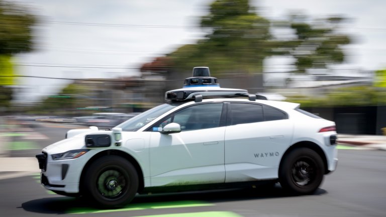A Waymo vehicle drives down a street on Wednesday, May 13, 2026 in Santa Monica, CA.