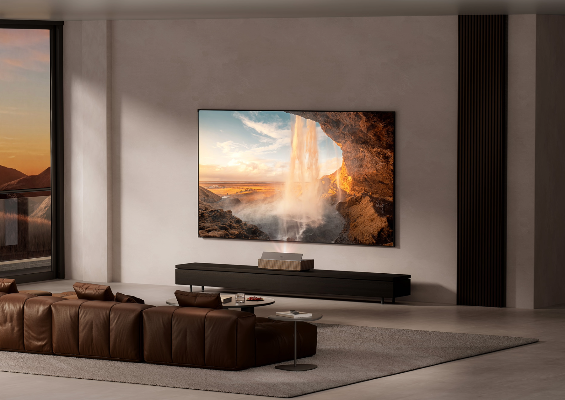 a sleek and modern living room with a flat TV on the wall. a video of a waterfall is on the TV