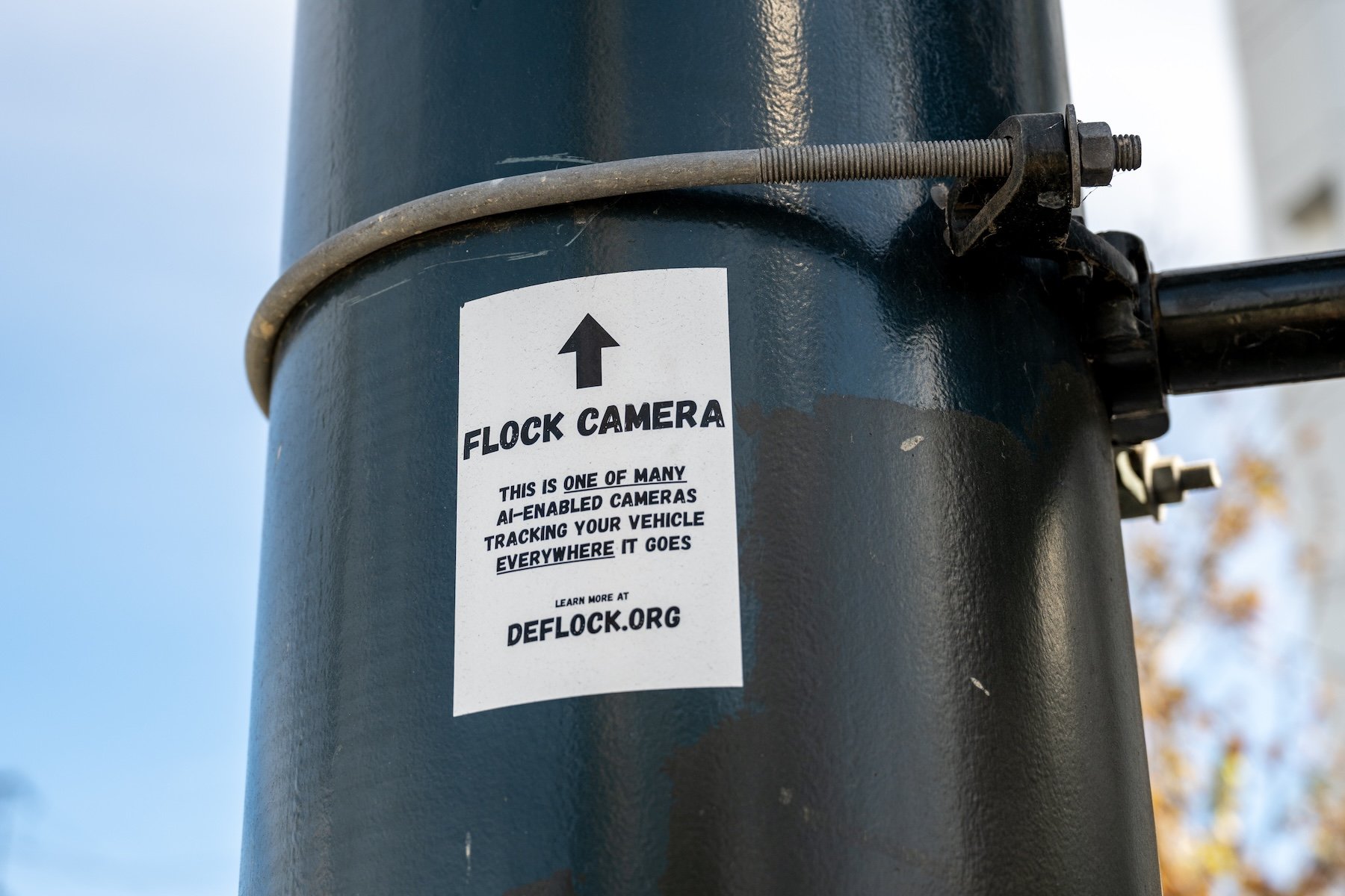 DeFlock privacy advocacy sticker warns of a nearby Flock Safety AI-enabled automated license plate reader tracking vehicles, San Francisco, California, September 9, 2026. (Photo by Smith Collection/Gado/Getty Images)