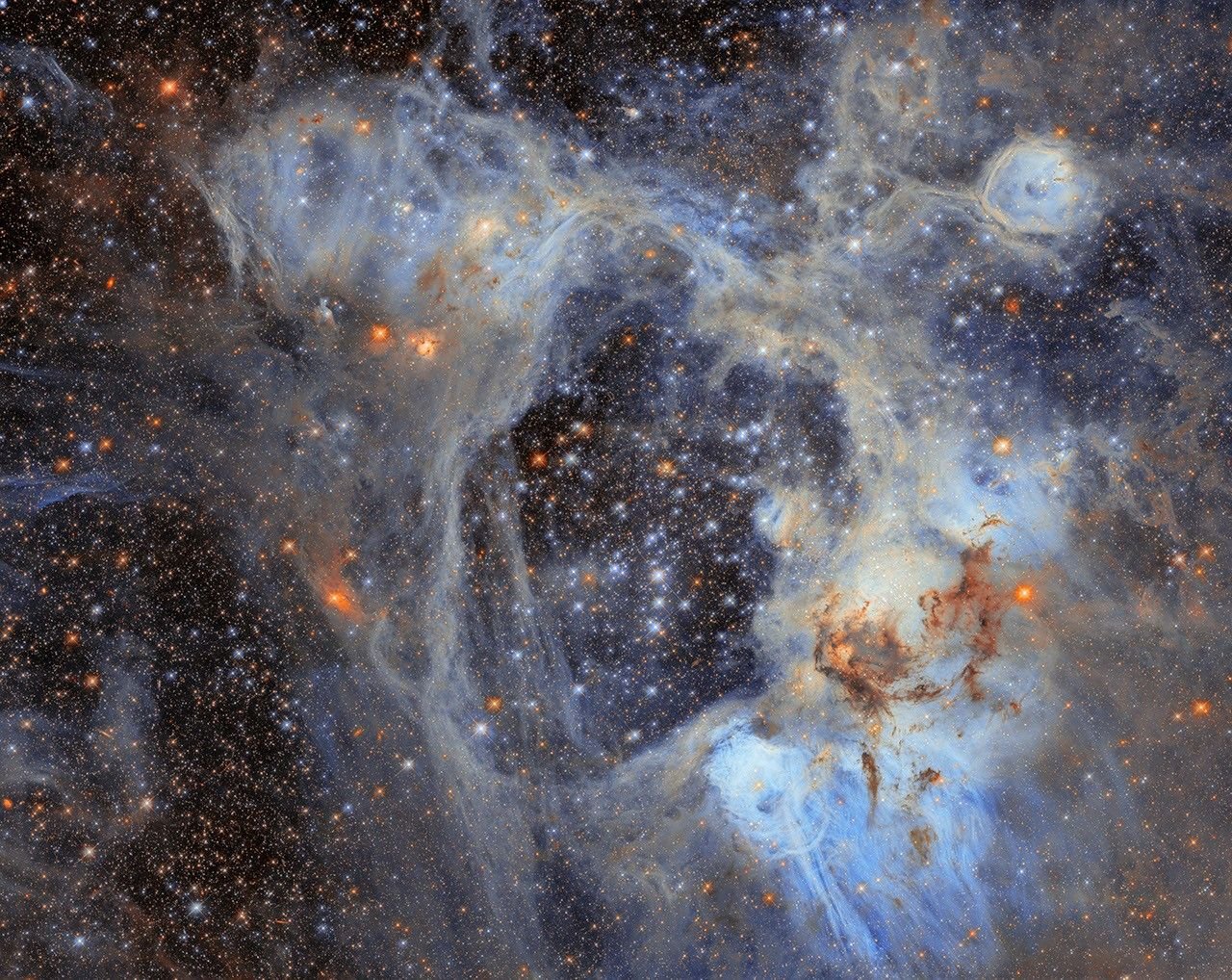 This Hubble Space Telescope image features the picturesque nebula LHA 120-N44, or N44. The interstellar bubble N44F is at the top right corner. Image: NASA, ESA/Hubble, D. Gouliermis.