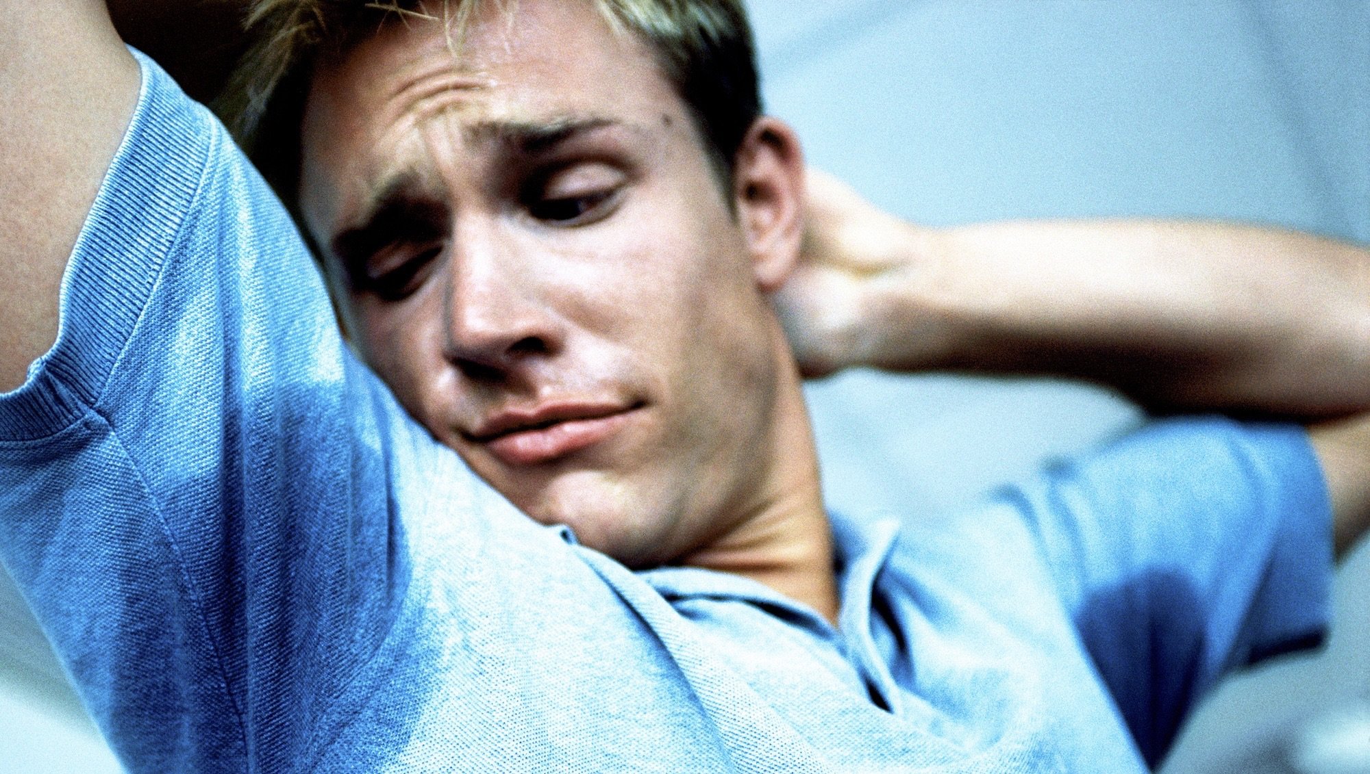 Man with sweat under arms