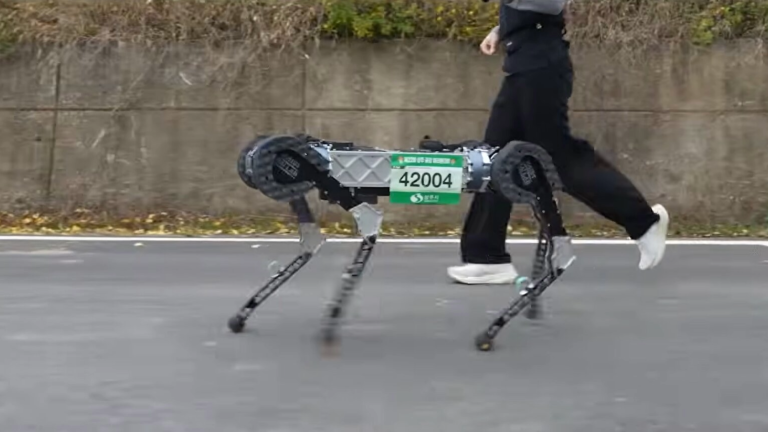 a four legged robot running in a race. it has a green and white race bib with the number 42004 on it