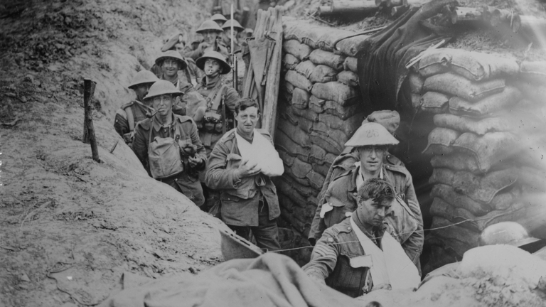 a black and white photo of wounded soldiers in a trench