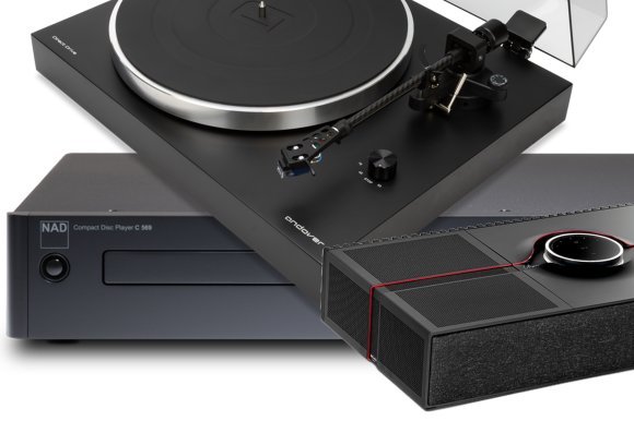 Three black audio components stacked on each other