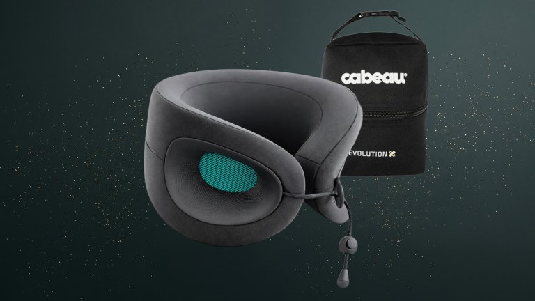 Cabeau Evolution X Deluxe neck pillow on a green sparkly travel gift guide background