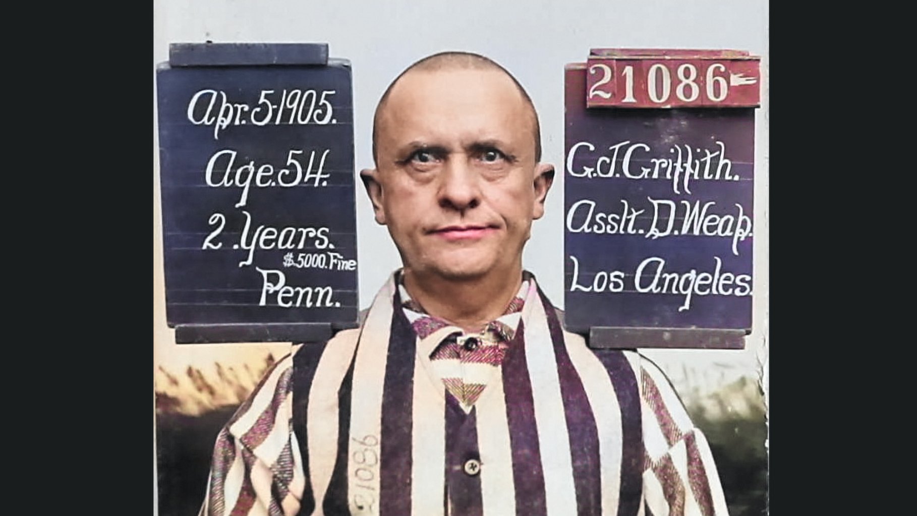 Vintage mug shot of a white man with no hair.
