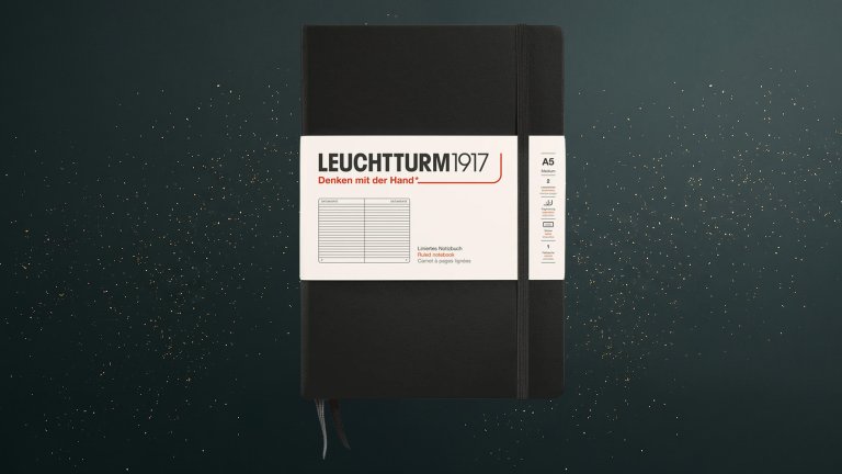 Black LEUCHTTURM1917 A5 Medium Notebook against a green speckled practical gift guide background