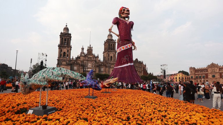 MEXICO CITY, MEXICO - OCTOBER 29: A giant 33-meter-tall Catrina sculpture is displayed at Zocalo Square in Mexico City, Mexico on 29, 2026. Standing 33.411 meters tall and weighing over 100 tons, the installation featuring a steel frame, fiberglass components, a 27-meter-long dress, and 100,000 marigold flowers was recognized by Guinness World Records as the world's tallest Catrina. (Photo by Daniel Cardenas/Anadolu via Getty Images)