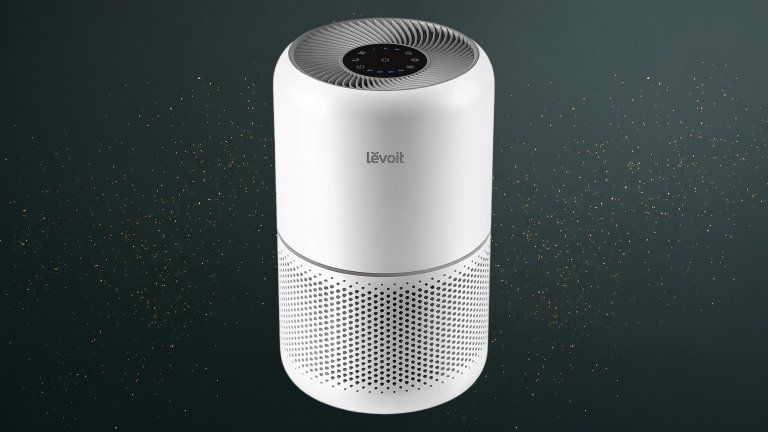 White Cylindrical Levoit Core300-P Air Purifier against a green speckled practical gift guide background