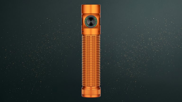 Orange OLIGHT Baton4 Pro EDC Flashlight against a green speckled practical gift guide background