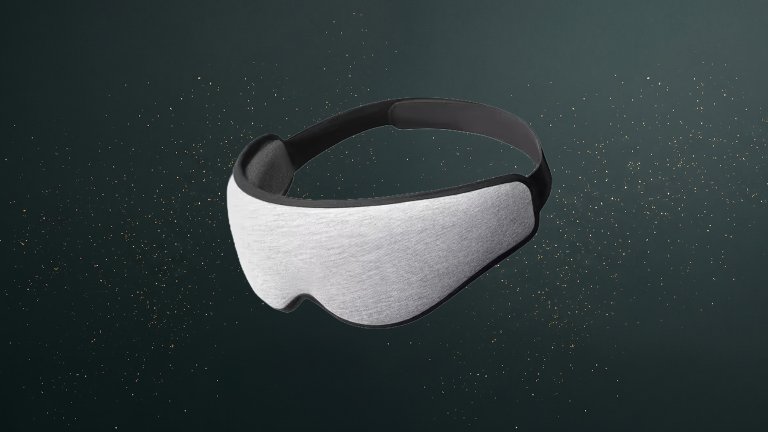 Ostrichpillow Eye Mask on a green sparkly travel gift guide background