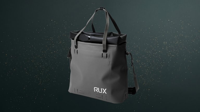 Black RUX Waterproof Tote Bag 15L against a green speckled practical gift guide background