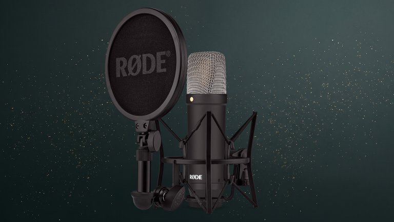 Black Rode NT1 Signature Series microphone with pop screen against a green speckled practical gift guide background