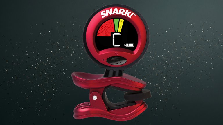 Red Snark ST 2HPT High Precision Rechargeable Tuner against a green speckled practical gift guide background