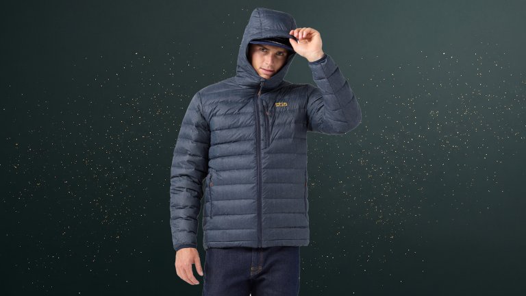 Stio Hometown Special Edition Denim-print Down Jacket against a green speckled practical gift guide background