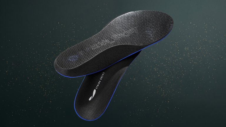 Black Stride Custom Insoles against a green speckled practical gift guide background
