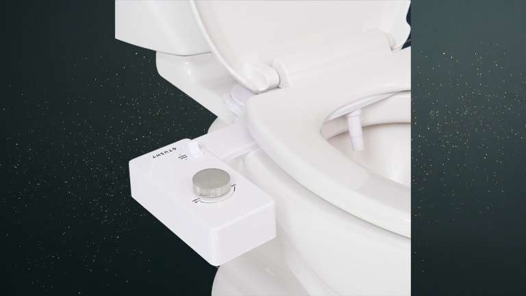 White TUSHY Classic 3 Bidet against a green speckled practical gift guide background