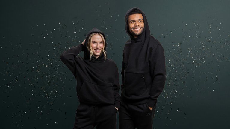 Trtl Travel Hoodie on a green sparkly travel gift guide background