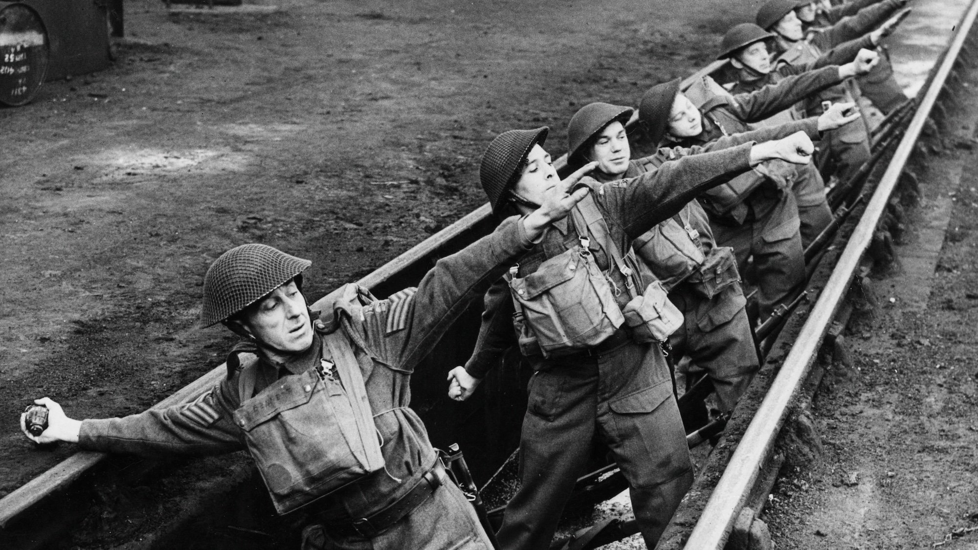 11th December 1942: Home Guards practising throwing hand grenades from a sunken railway track doubling as a trench. (Photo by M. McNeill/Fox Photos/Getty Images)