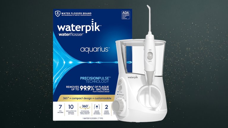 Waterpik Aquarius Countertop Water Flosser against a green speckled practical gift guide background