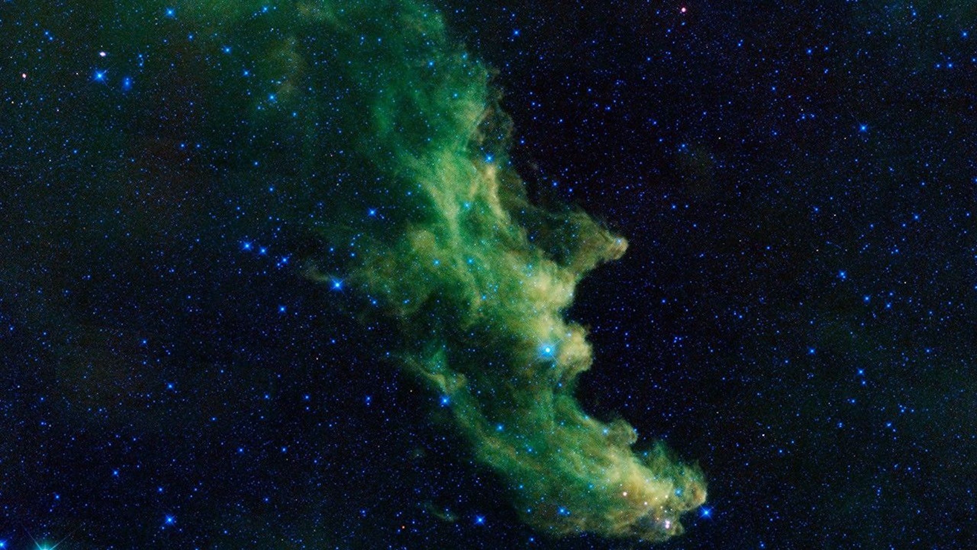 Nebula with green clouds that resemble a witch's head