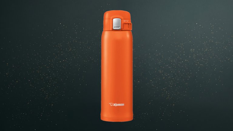 Zojirushi 16 oz Stainless Mug on a green sparkly travel gift guide background
