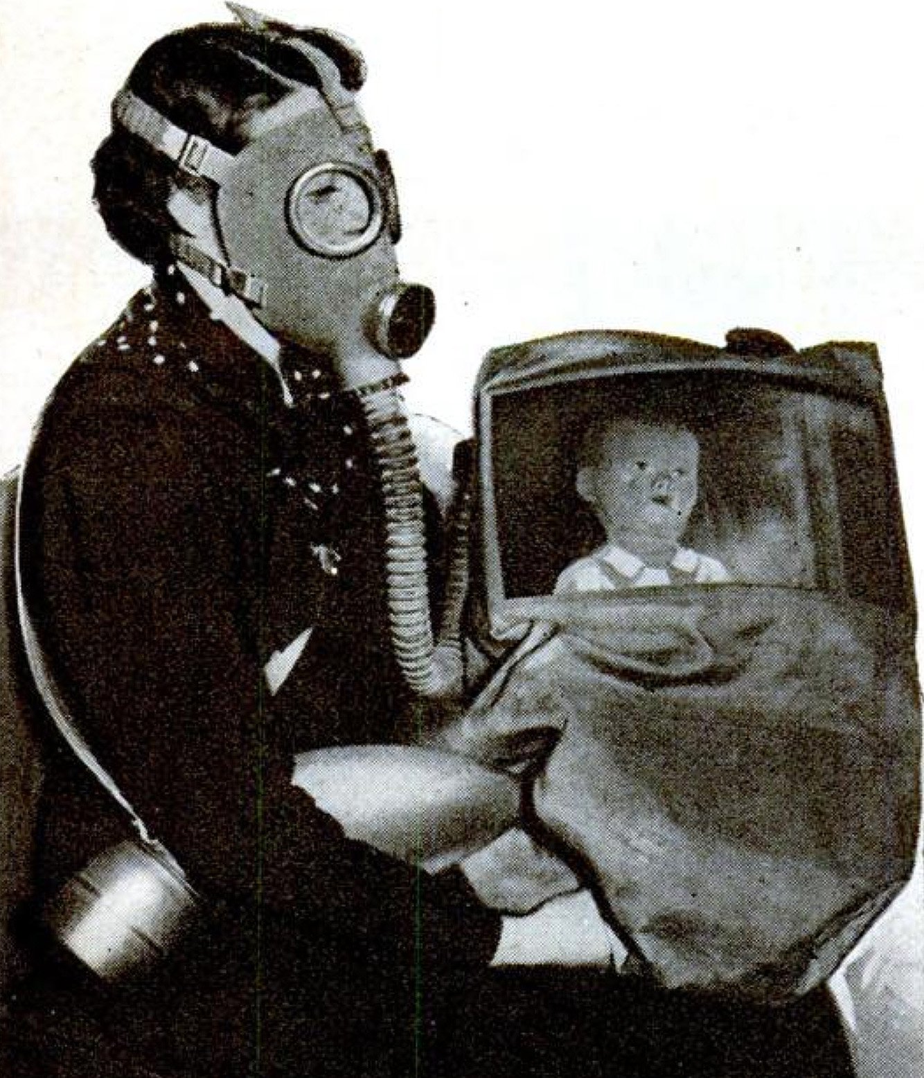 Illustration of a woman holding a child in a gas mask shelter.