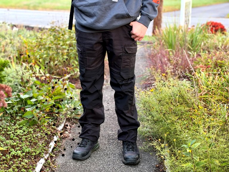 Carhartt Steel series pants on a person with boots