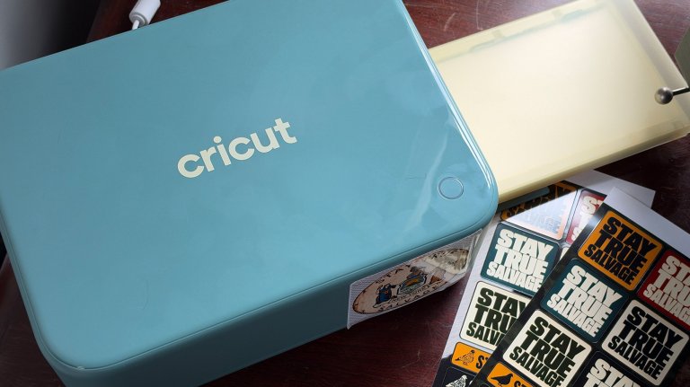 Cricut StickerPix Print + Cut on a desk with stickers