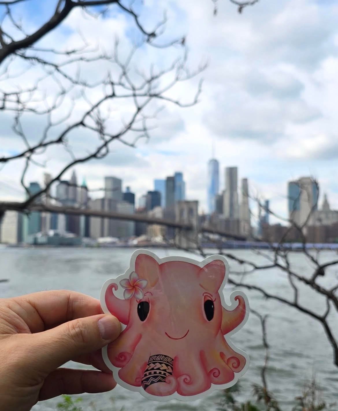 an illustrated pink octopus underneath the brooklyn bridge