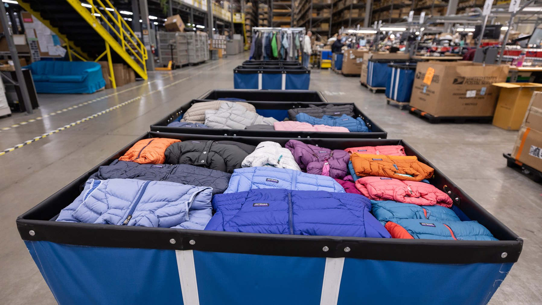 Patagonia puffer jackets in a bin
