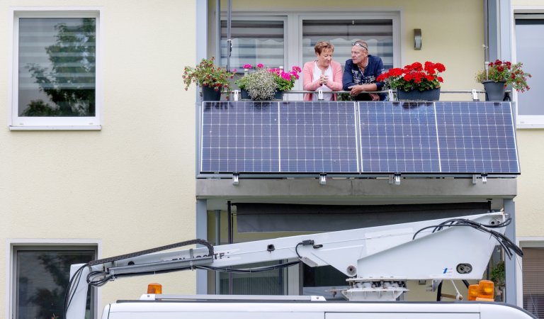 couple on balcony with solar power